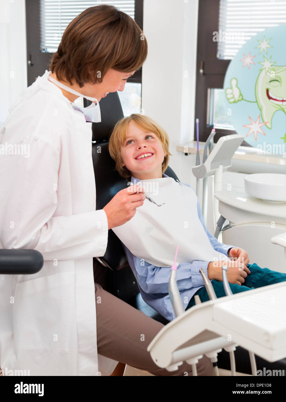 Boy in dentists chair at check up Stock Photo