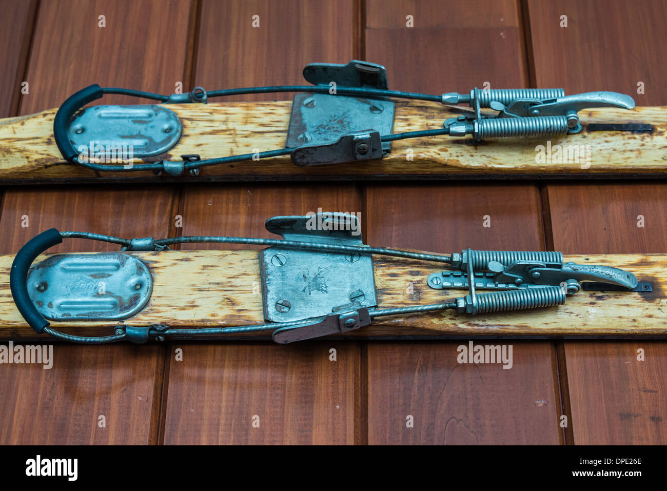 Old fashion hand-made metal ski clamps. Stock Photo