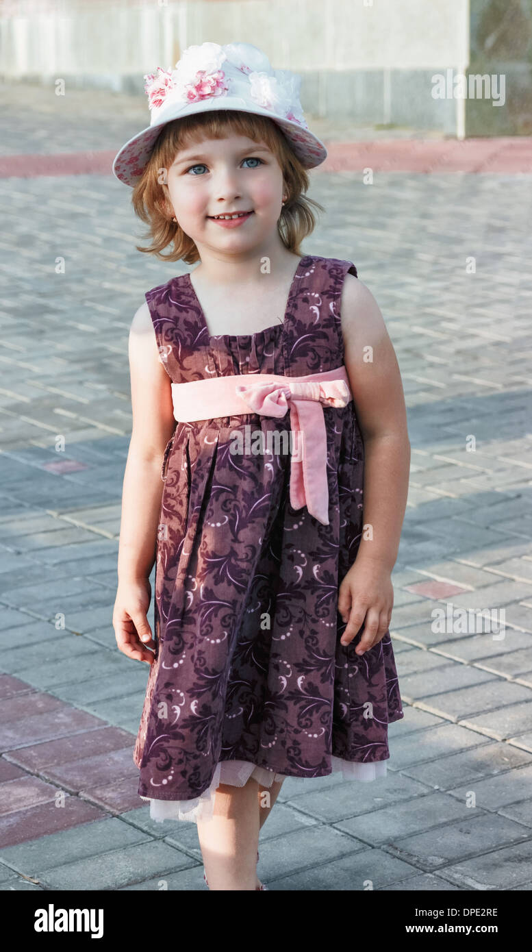 Portrait of the girl in a hat at city square Stock Photo - Alamy