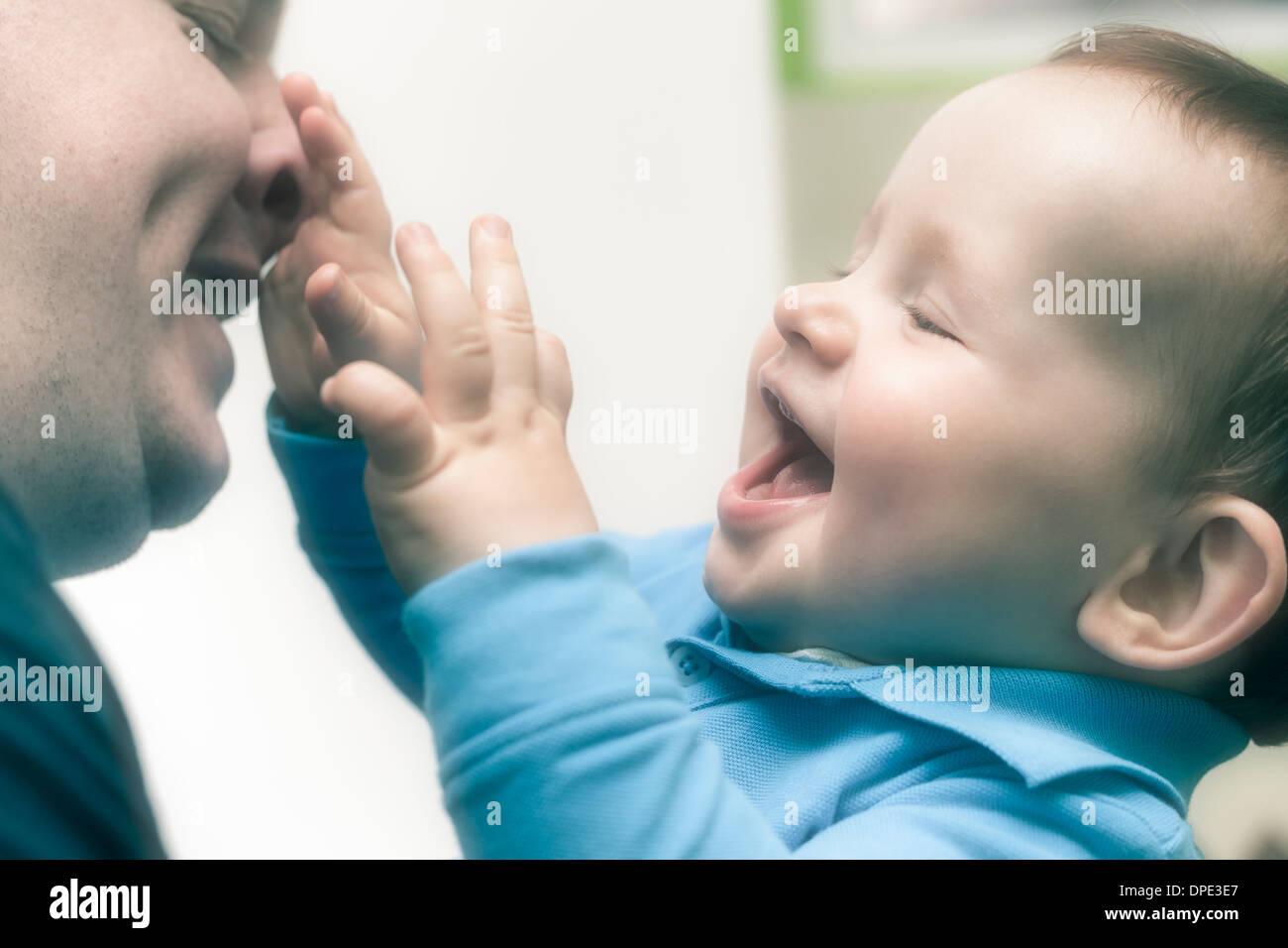 Closeup of happy child boy playing with his daddy. Stock Photo