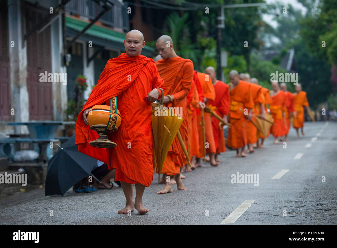 Monks on the morning alms round, Luang Prabang, Laos Stock Photo