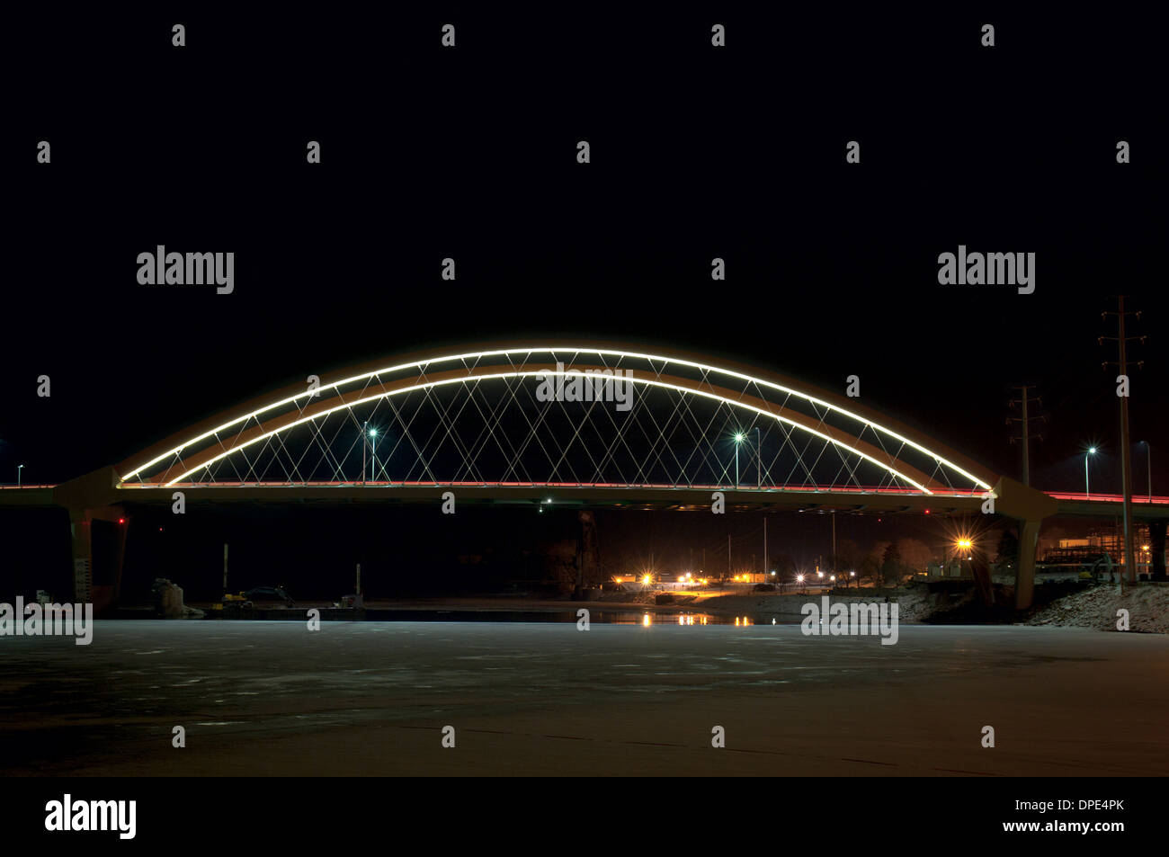 tied arch bridge spanning mississippi river illuminated at night in hastings minnesota Stock Photo