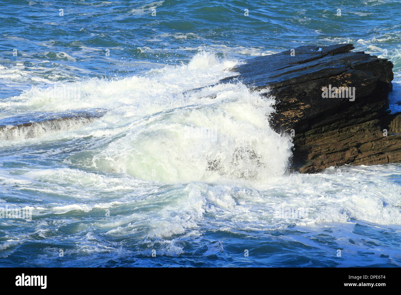 Breaking waves on rocky North Cornwall Coast, England, UK Stock Photo ...
