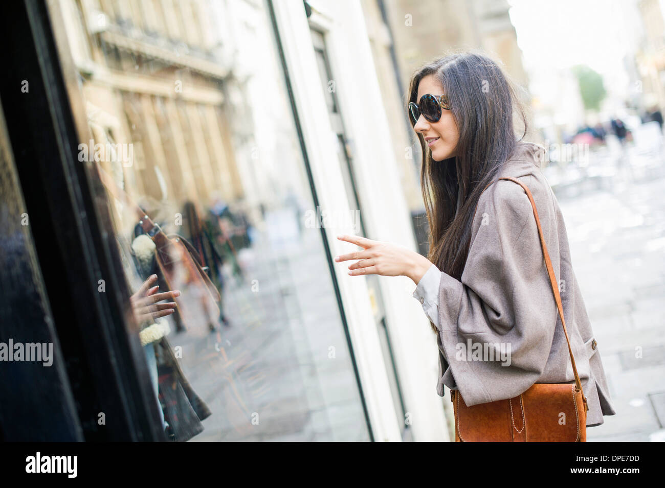 Young woman window shopping Stock Photo