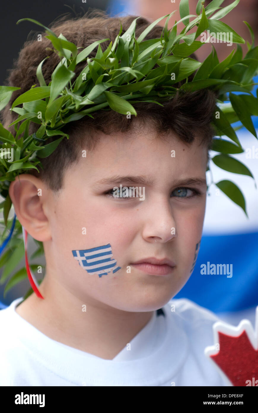 Young boy wearing a laurel wreath on his head and a painted flag of Greece  on his cheek Stock Photo - Alamy