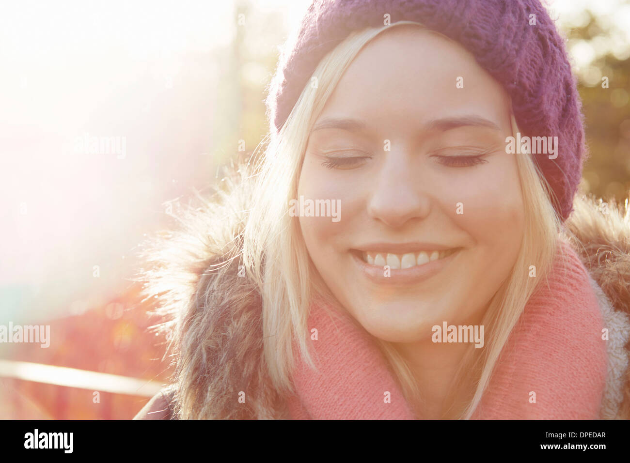 Portrait of young woman wearing knit hat, eyes closed Stock Photo - Alamy