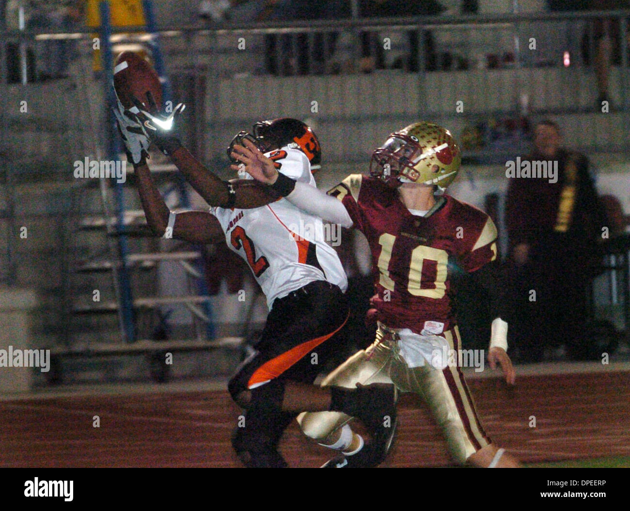 (Published 11/4/2006, D-1:R)  Nov. 3, 2006. San Marcos,  Ca.  Escondido Highs # 2 BRAD CABLE bobbles the ball in the endzone and doesn't make the catch in the first half.Covering is  Mission Hills # 10 JORDAN HASLEY.  Mandatory Credit:  Photo by Don Kohlbauer/ San Diego Union Tribune/Zuma Press.copyright 2006 San Diego Union-Tribune Stock Photo