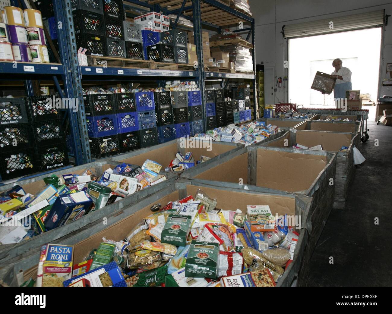(Published 08/18/2005, A-1) Peter Babbs, a volunteer at the North County Food Bank in San Marcos, sorts food before shoppers come through. Second Harvest story. UT/DON KOHLBAUER Stock Photo