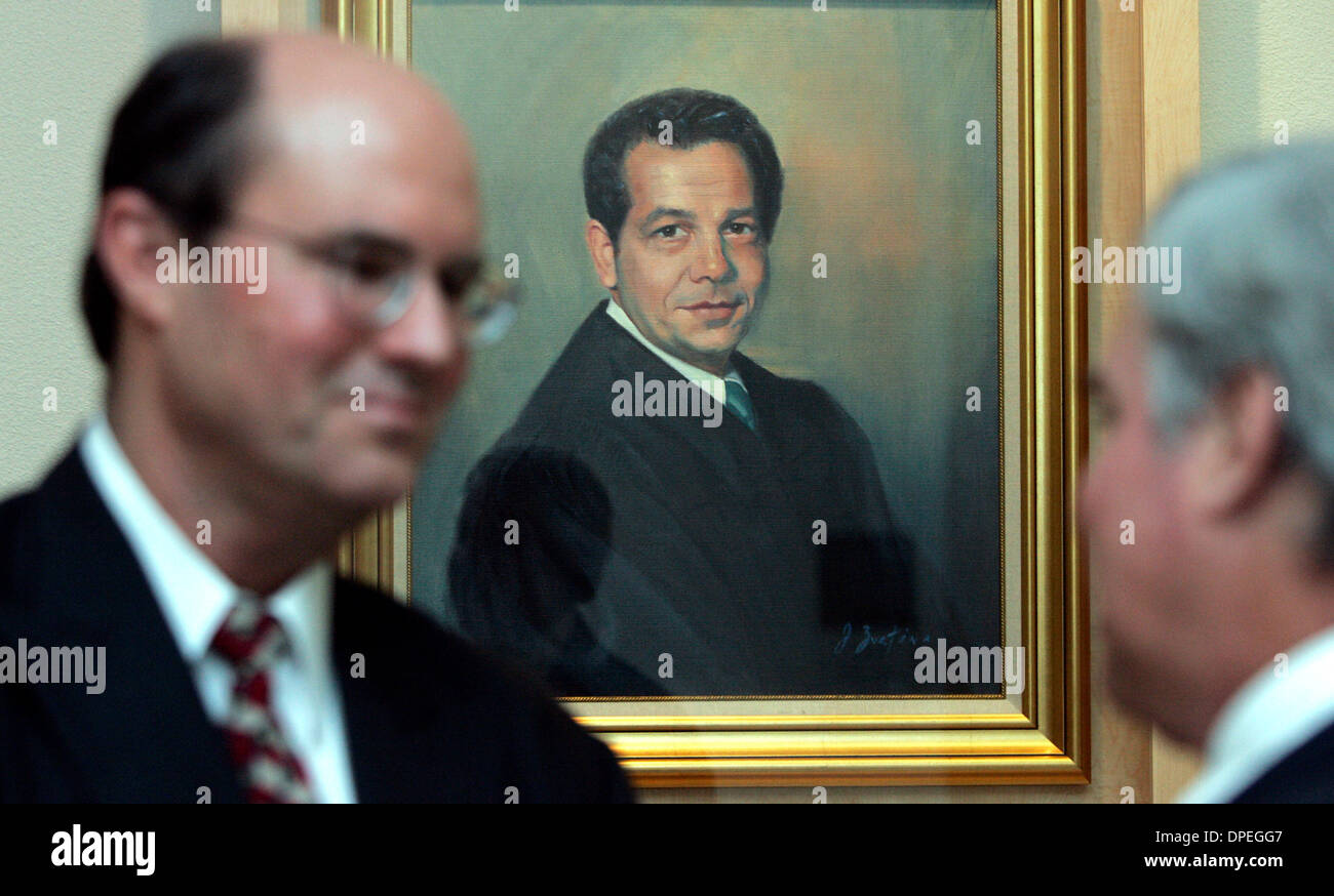 (Published 6/16/2006, NI-1, NC-1)  JUNE 15, 2006 Attorney STEPHEN V. LOPARDO(cq), left, chats with JAMES E. LUND(cq), near a portrait of Lopardo's father, FIORENZO V. LOPARDO at the Vista Courthouse.  Lund is president of the North County Bar Association and spoke during a ceremony to honor distinguished jurists like the senior Lopardo, and a new gallery displaying their likeness.  Stock Photo