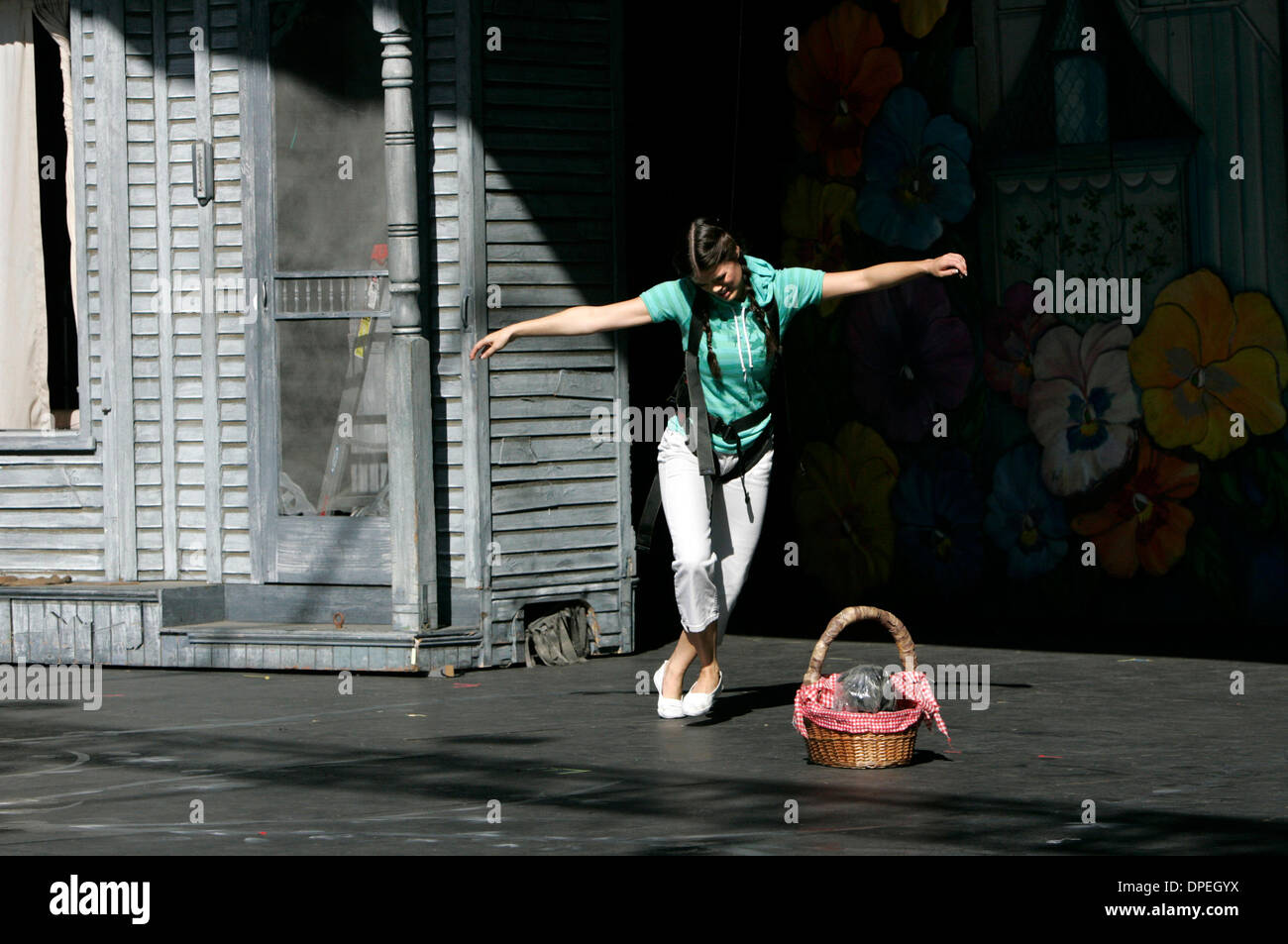 (Published 8/20/2006, F-3) August 4, 2006 San Diego, CA  LINDSEY GRUBBS, 18, practices flying for the tornado scene in her role as Dorothy in Starlight Musical Theatre's procution of the Wizard Stock Photo