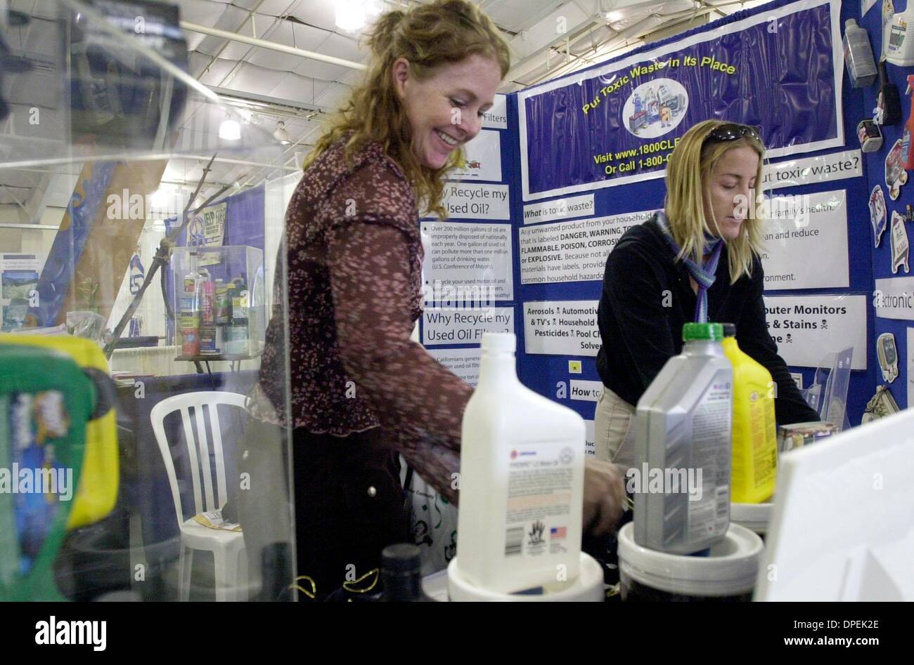 (Published on 11/6/2004, B-3:2, NC-1; UTS1842909) Stephanie Ewalt (left), program manager for Solana Center for Environmental Innovation, and Diane Rosenkranz, a program coordinator, set up their both at the Enviro Fair at the Del Mar Fairgrounds on Friday.  The group is based in Encinitas and is a non-profit organization the does public outreach to educate consumers about environm Stock Photo