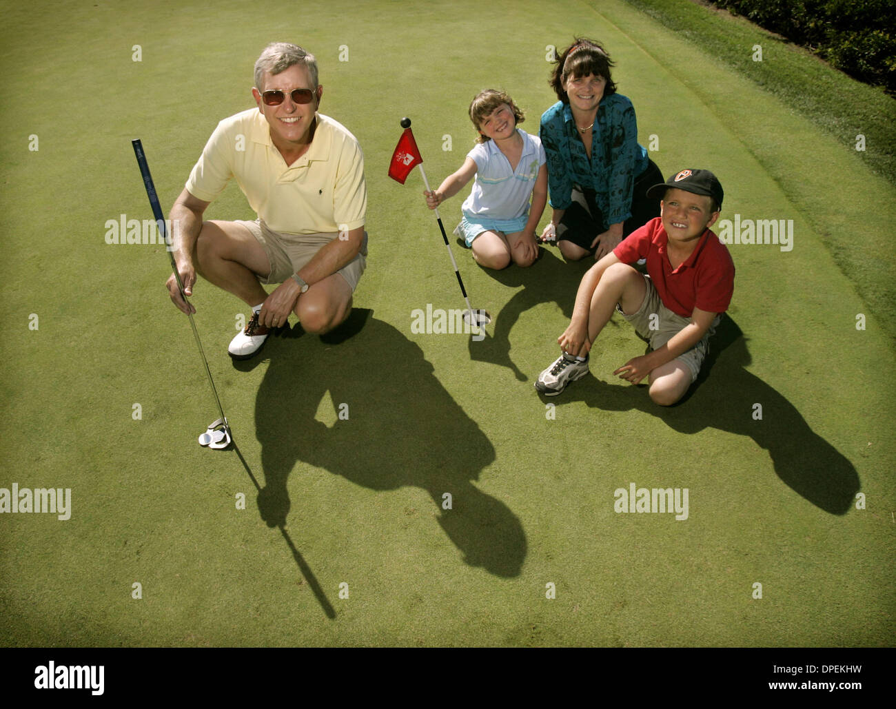 (published 9/21/2005, NC-4) Toy maker Dave Wyman, left, posed for a photo at the Rancho Santa Fe Farms Golf Course with his children Zach, 8, Nikki, 6, and wife Elaine Worzala. Stock Photo