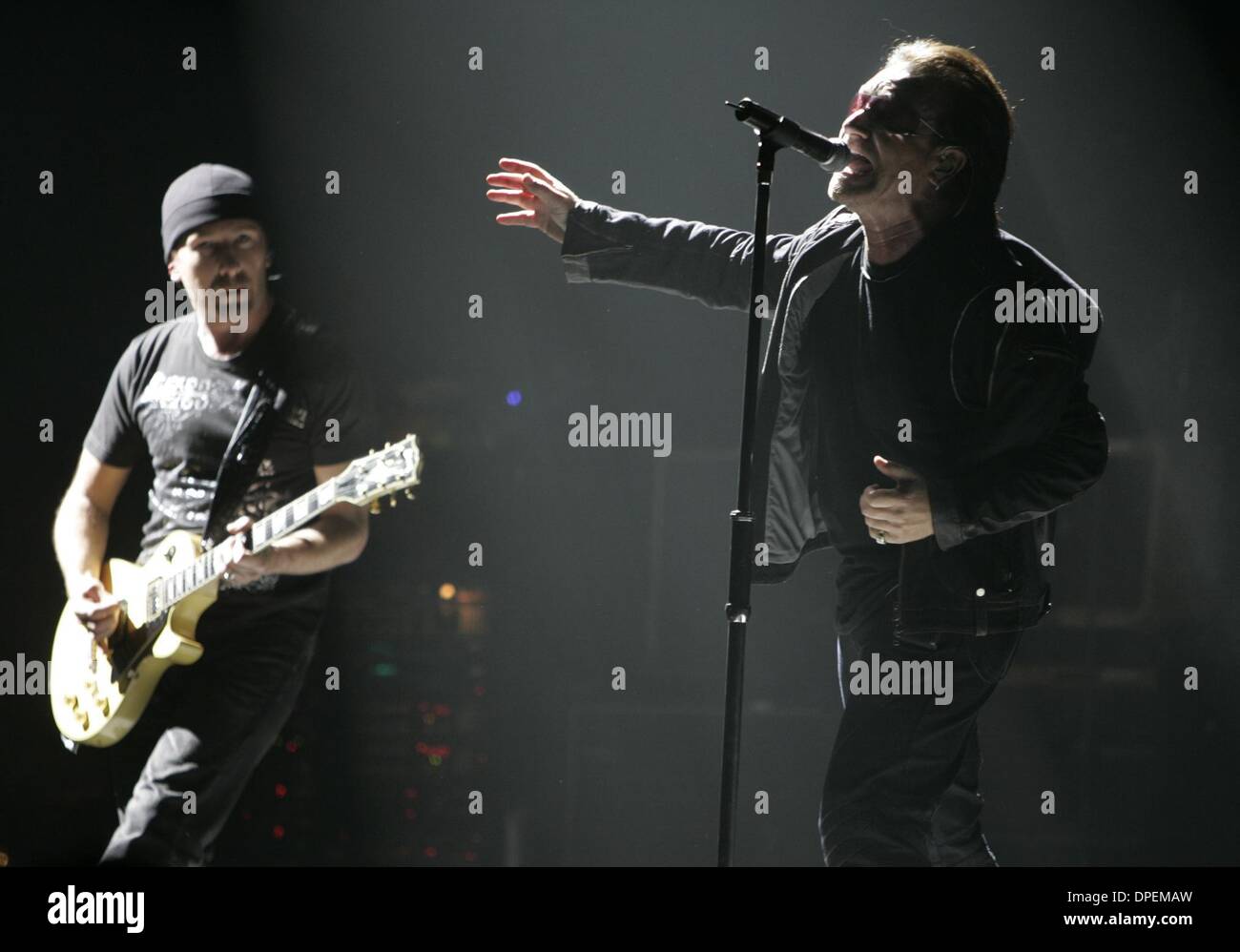 (Published 3/30/2005, F-5)  Bono, right, and The Edge, at the opening of the U2 concert Monday night at the Sports Arena. (POYi)Peggy Peattie photo Stock Photo