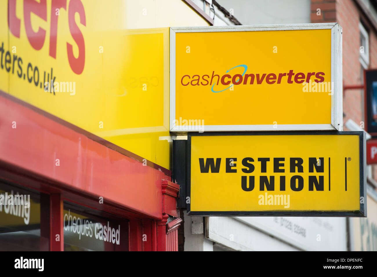 Cash Converters and Western Union money lending signage on high street shop in Fareham, Hampshire. Stock Photo