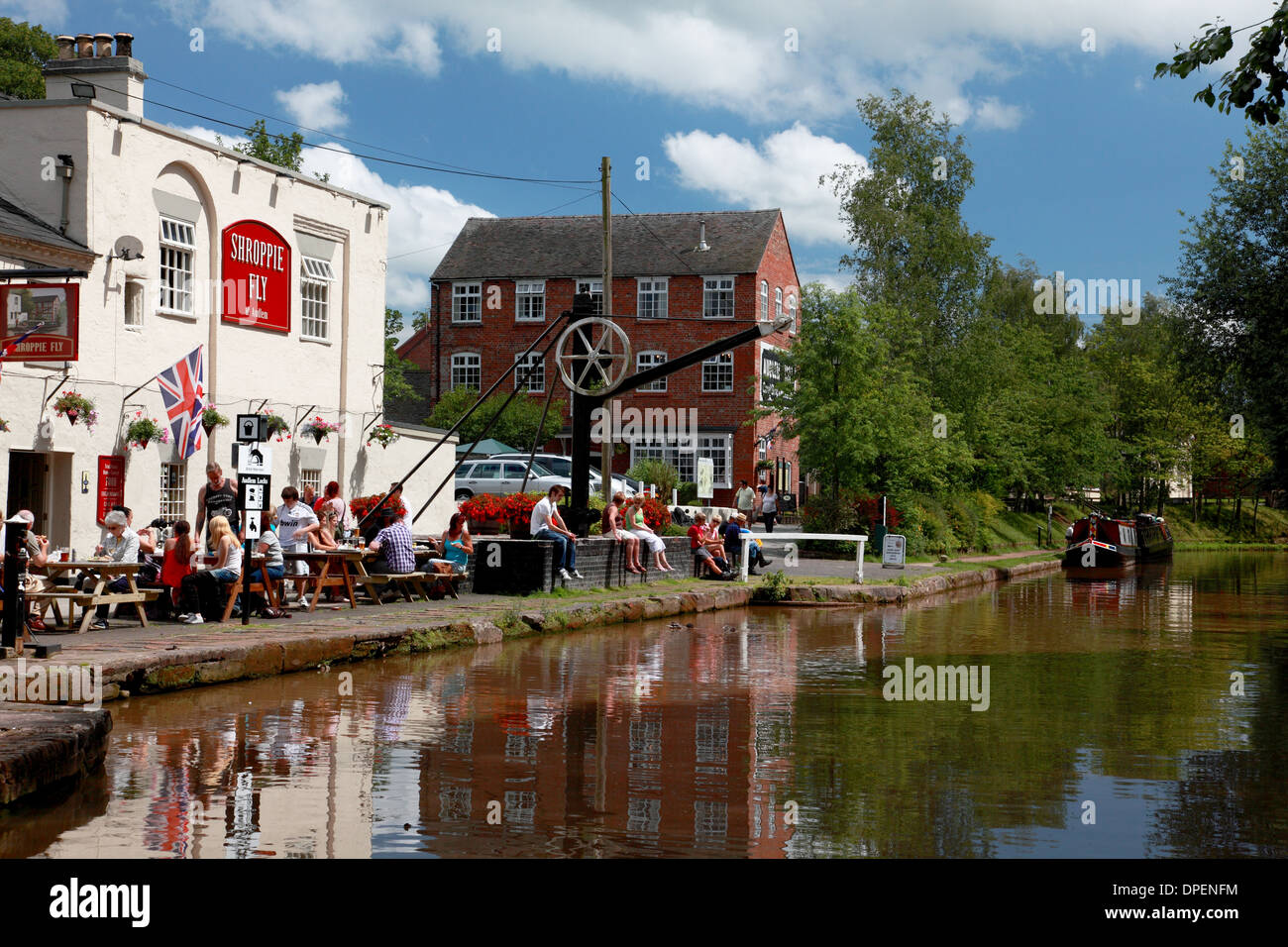 The Shroppie Fly pub and Audlem mill by the Shropshire Union Canal in the village of Audlem Stock Photo