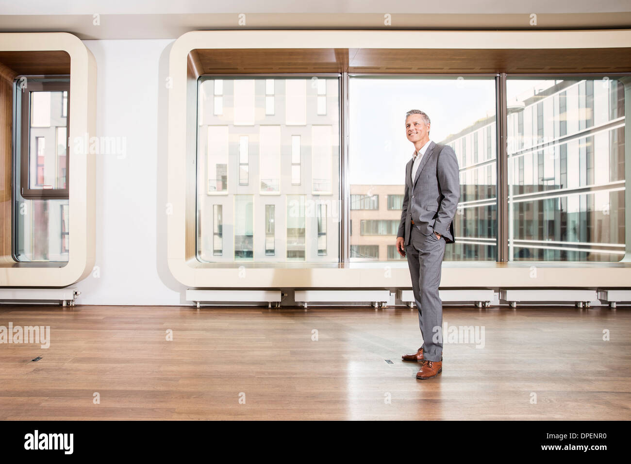 Businessman standing in office Stock Photo
