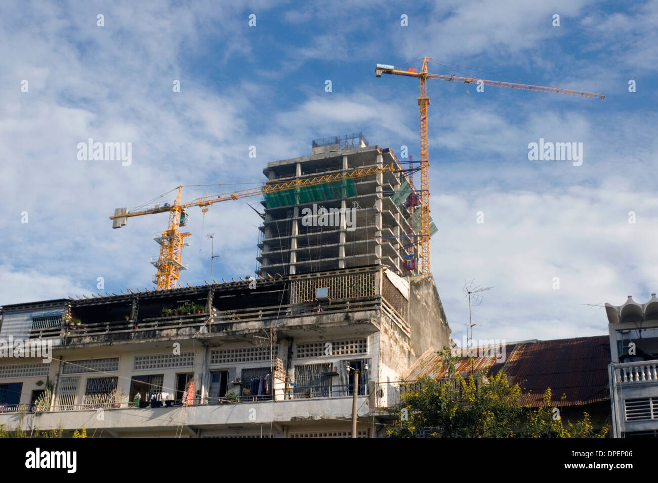 Large and tall cranes used to build skyscrapers towers over a
