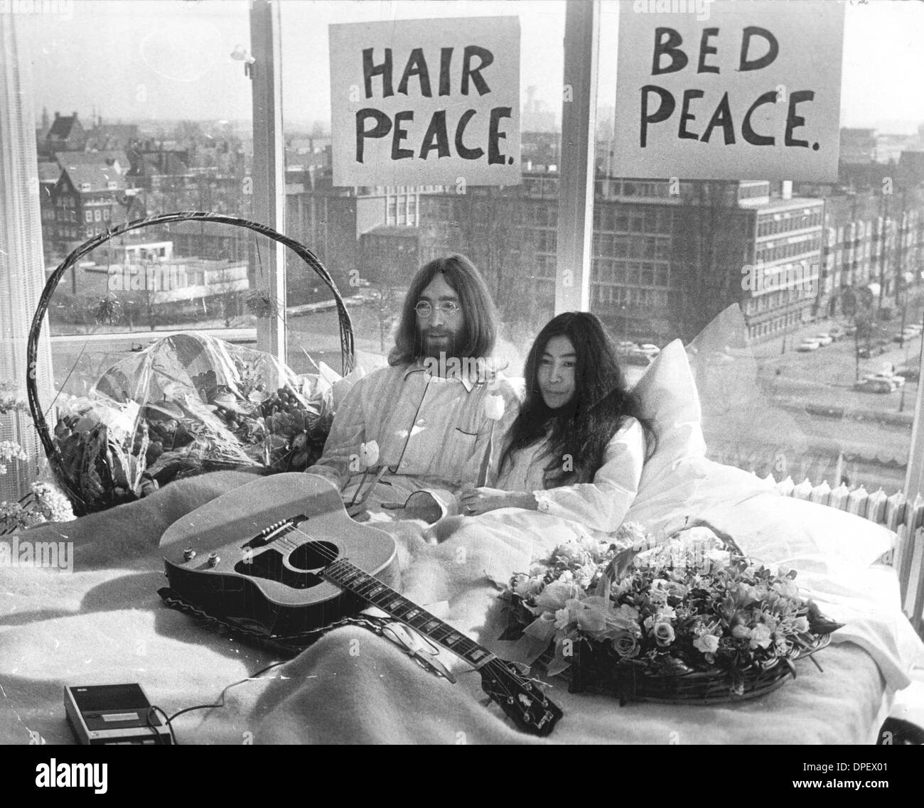 Mar. 25, 1969 - Amsterdam, Netherlands - Musician JOHN LENNON of the Beatles and his wife YOKO ONO speaking to the press during their honeymoon and 'lie-in' in Amsterdam. (Credit Image: © KEYSTONE Pictures USA/ZUMAPRESS.com) Stock Photo