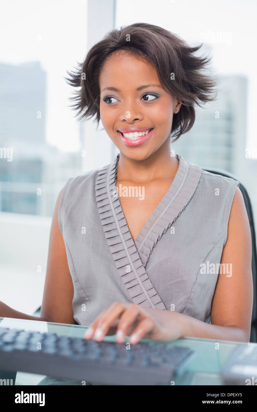 Happy businesswoman working on her computer Stock Photo - Alamy