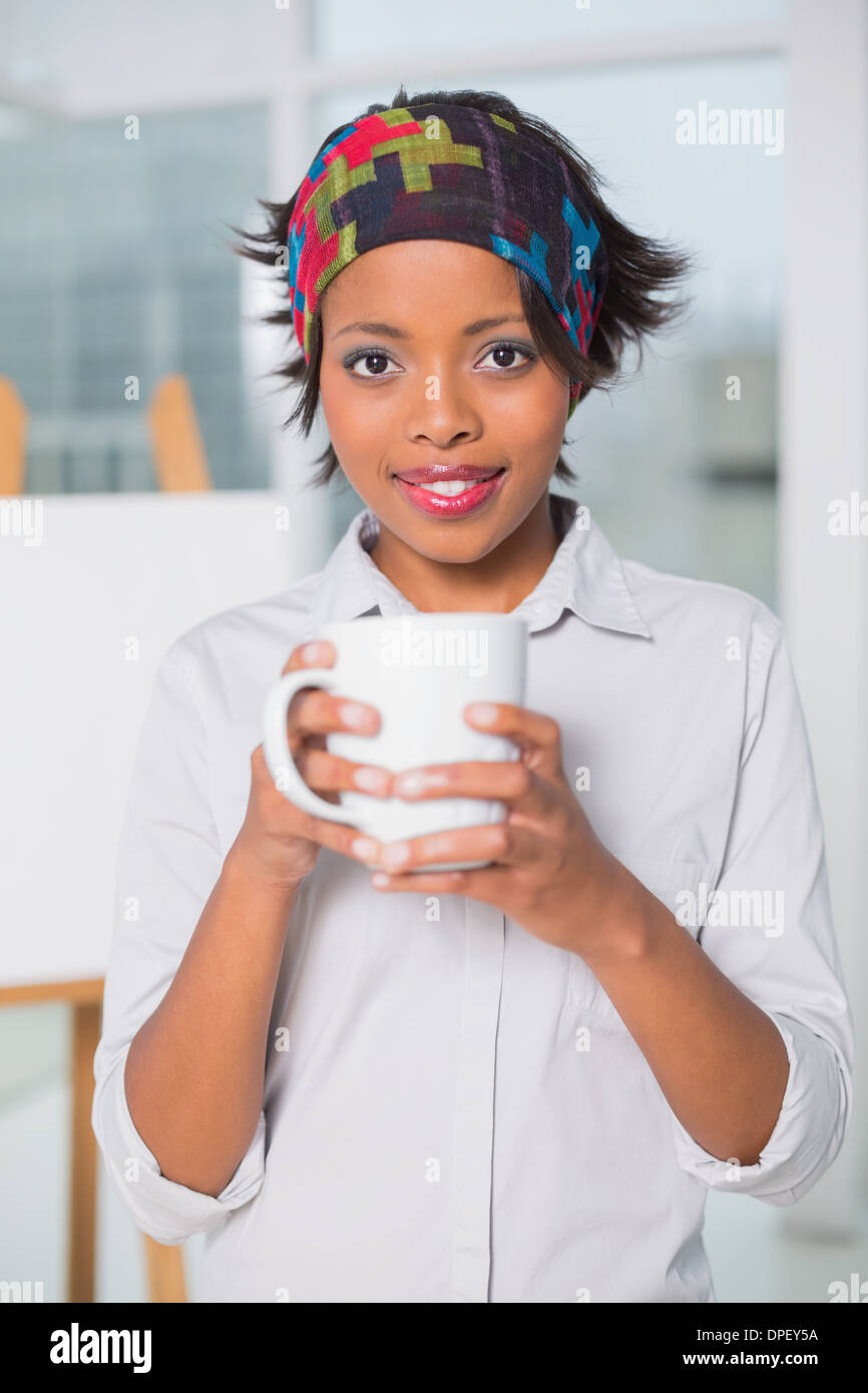 https://c8.alamy.com/comp/DPEY5A/artistic-woman-holding-cup-of-coffee-DPEY5A.jpg
