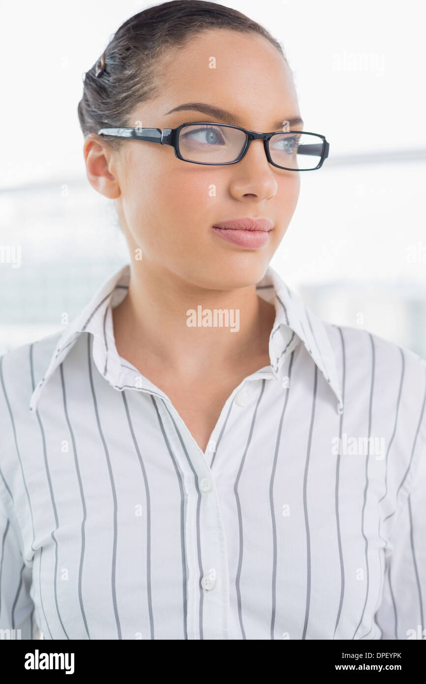 Pretty businesswoman with reading glasses Stock Photo