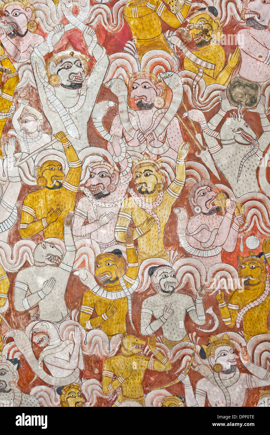 Colourful wall painting, fresco, demons engaged in a fierce battle, Maharaja-Iena cave, Buddhist cave temple of Dambulla Stock Photo