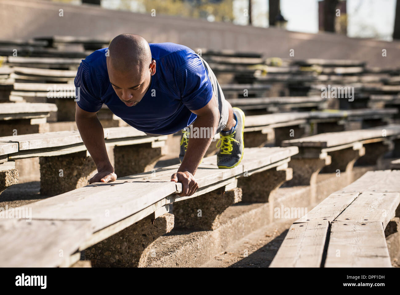 Man doing push ups on bench Stock Photo Alamy