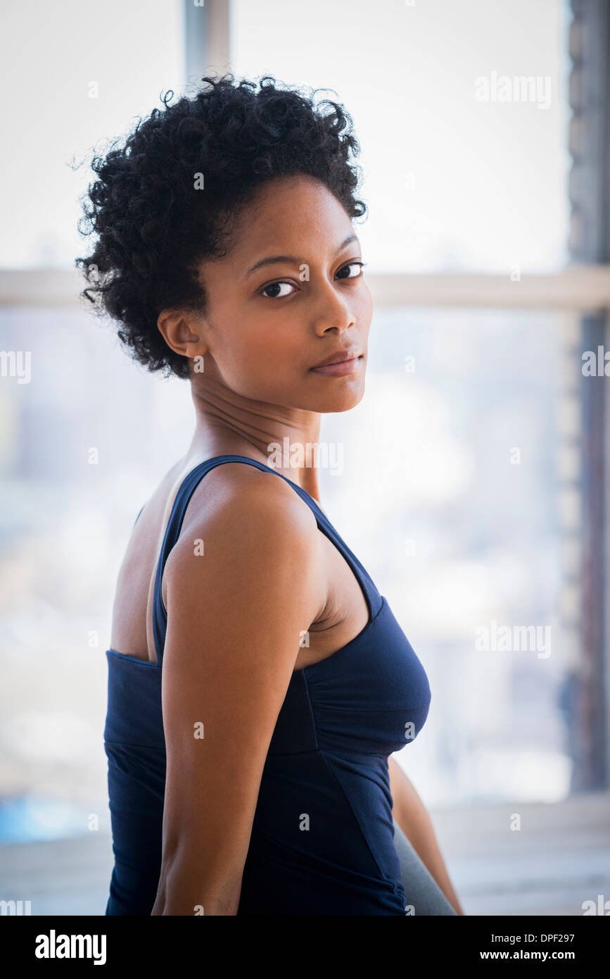 Woman looking over shoulder Stock Photo