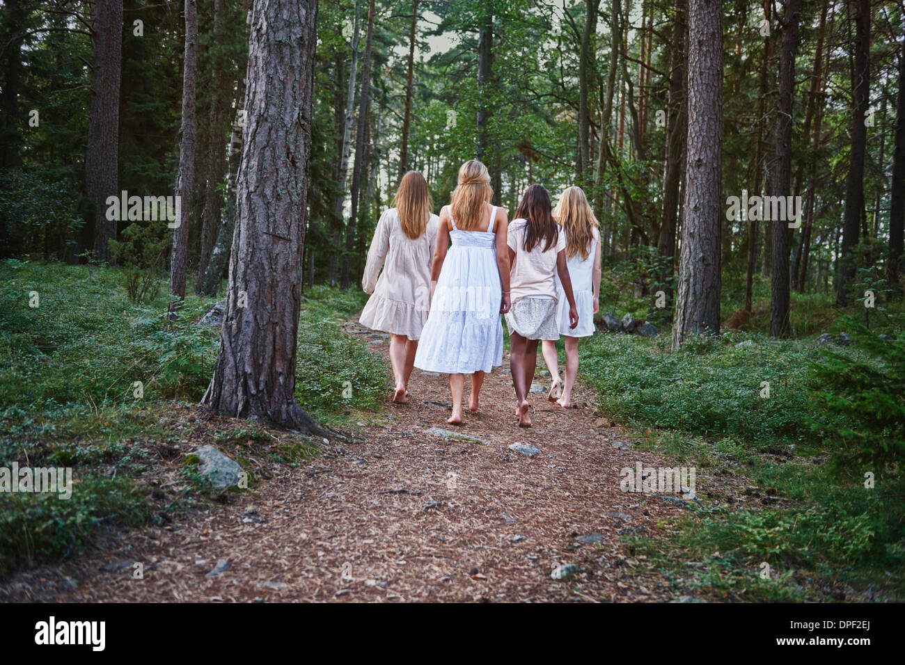 Teenage girls on forest track Stock Photo
