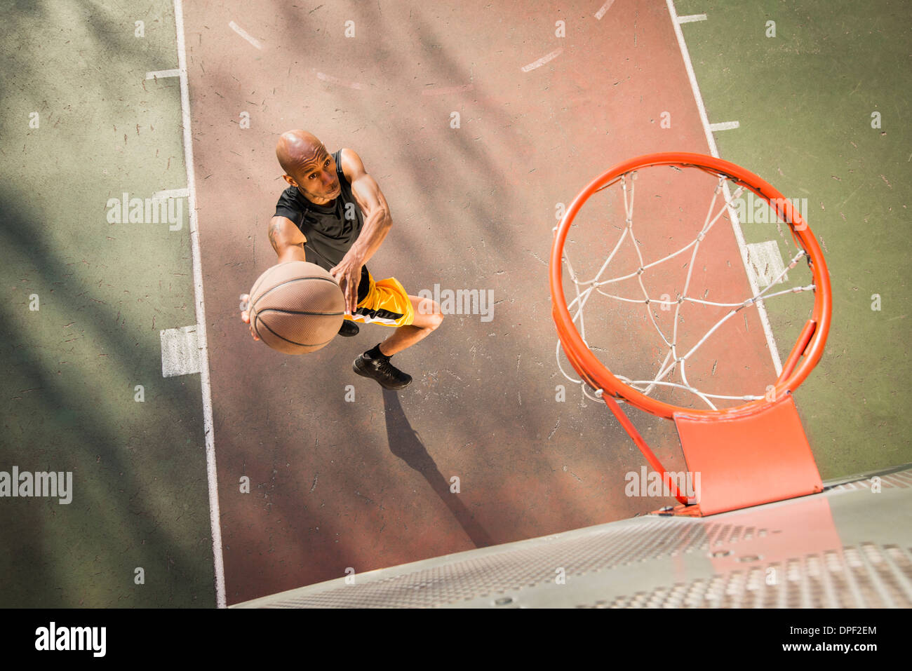 Basketball player shooting Stock Photo - Alamy
