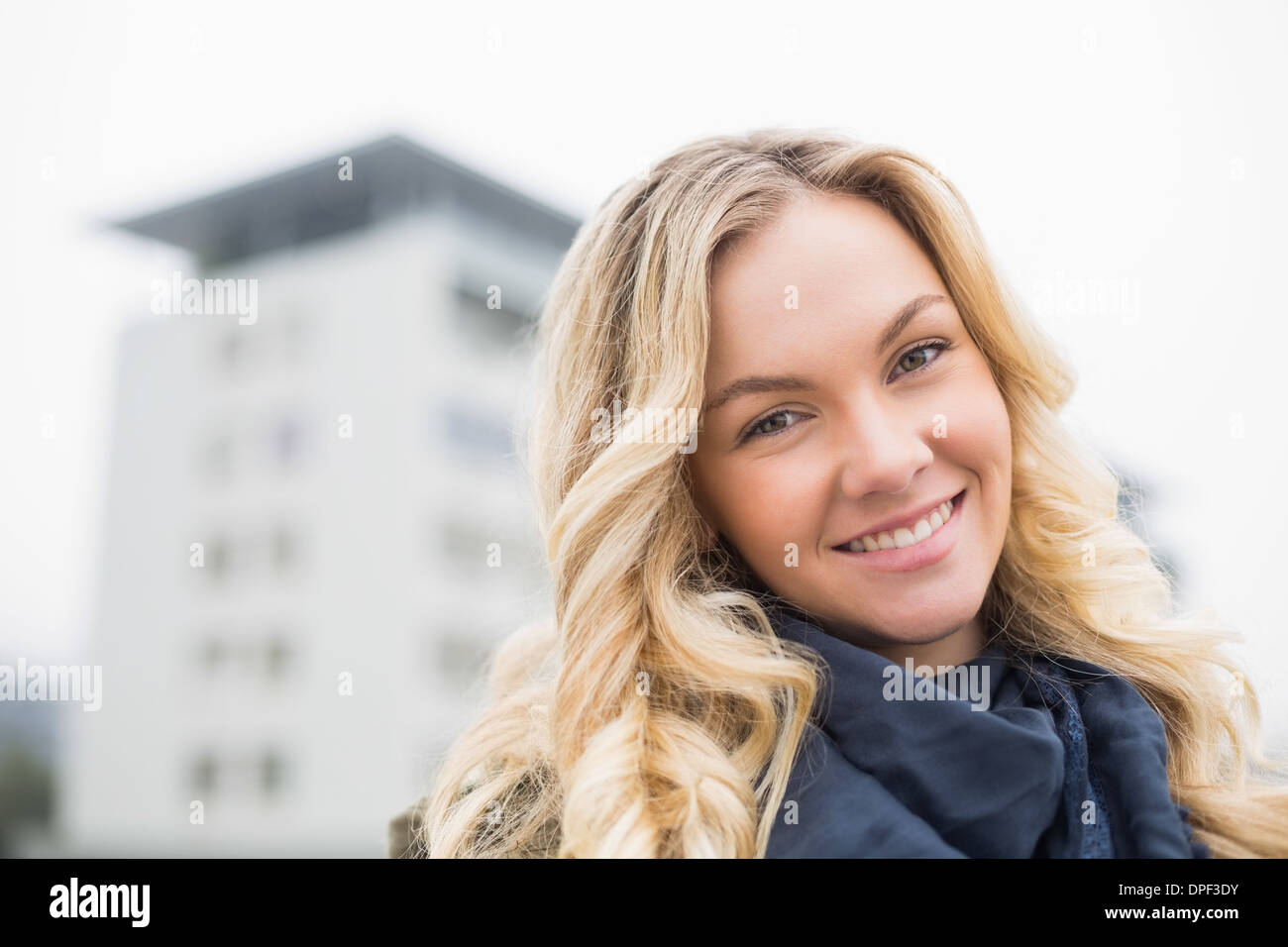 Happy attractive blonde posing outdoors Stock Photo