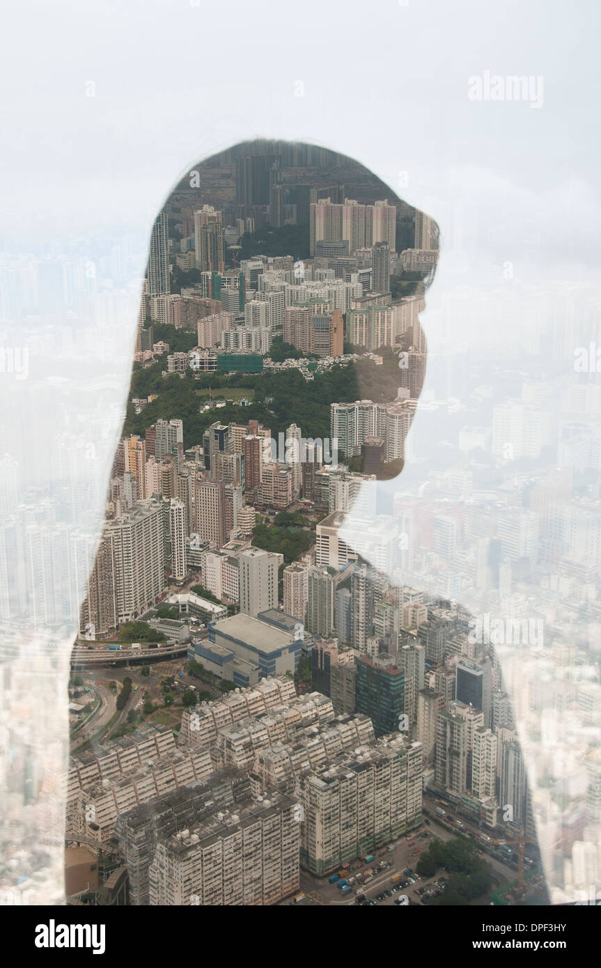 Businesswoman and Hong Kong cityscape, composite image Stock Photo