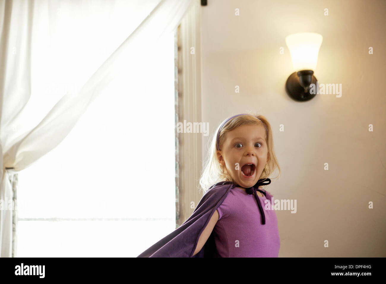 Portrait of young girl pulling a face Stock Photo