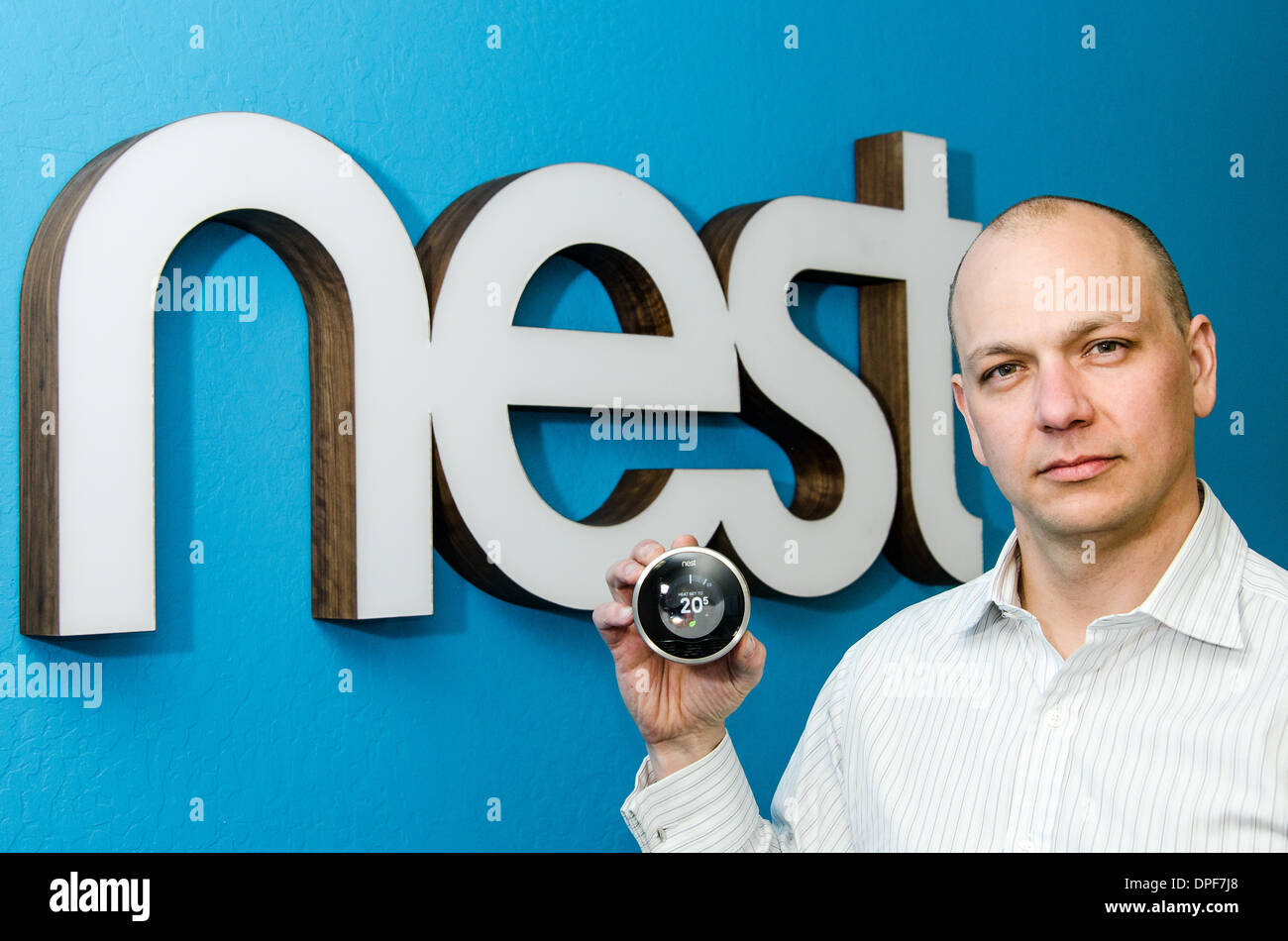 Smart appliances: At Apple, Tony Fadell helped develop both iPod and iPhone. He co-founded Silicon Valley start-up Nest, which develops intelligent appliances, such as the Nest thermostat that Fadell shows here in front of the company logo in 2012. Stock Photo
