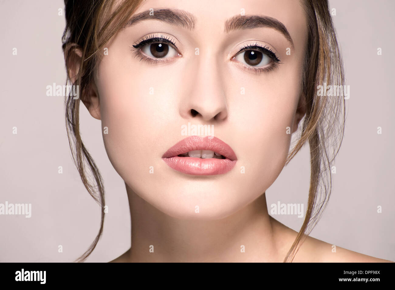 Cropped studio portrait of emotional young woman Stock Photo