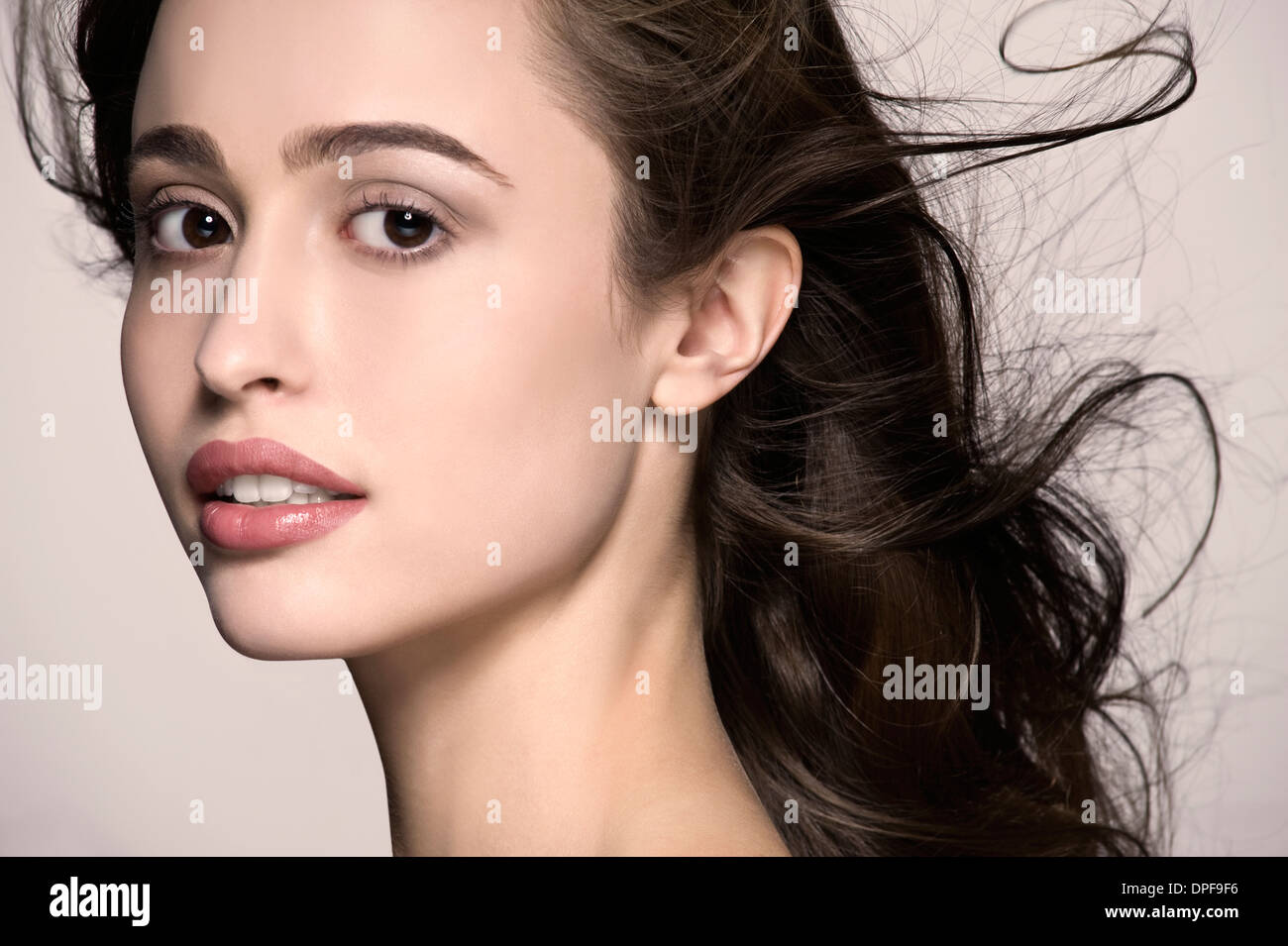 Cropped studio portrait of serene young woman Stock Photo