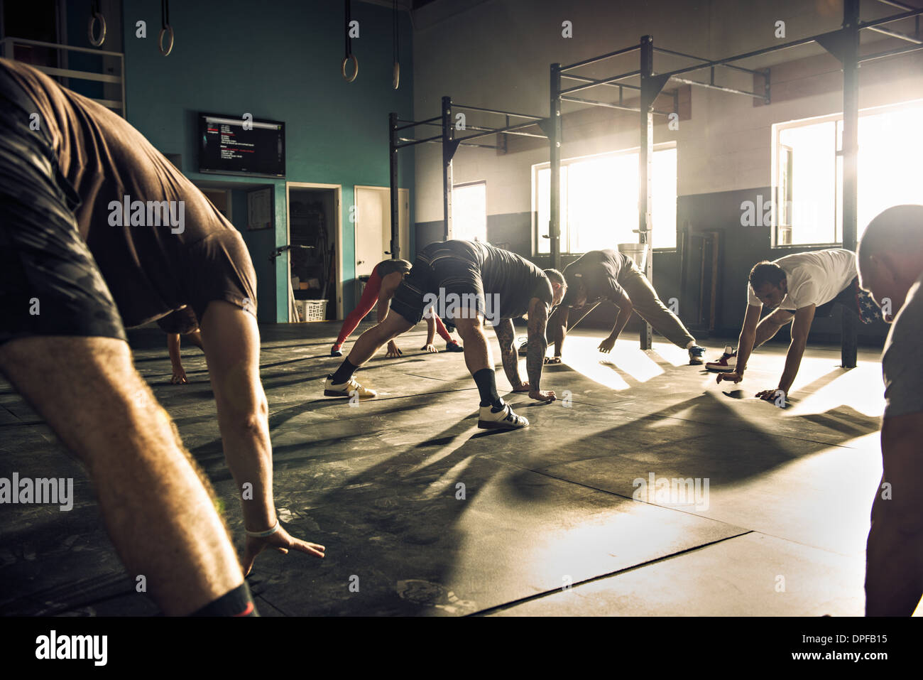 Fitness group training together in gym Stock Photo