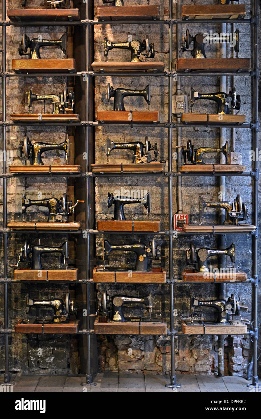 A display of vintage Singer sewing machines at All Saints, a clothing store  on Broadway in the Soho section of New York City Stock Photo - Alamy