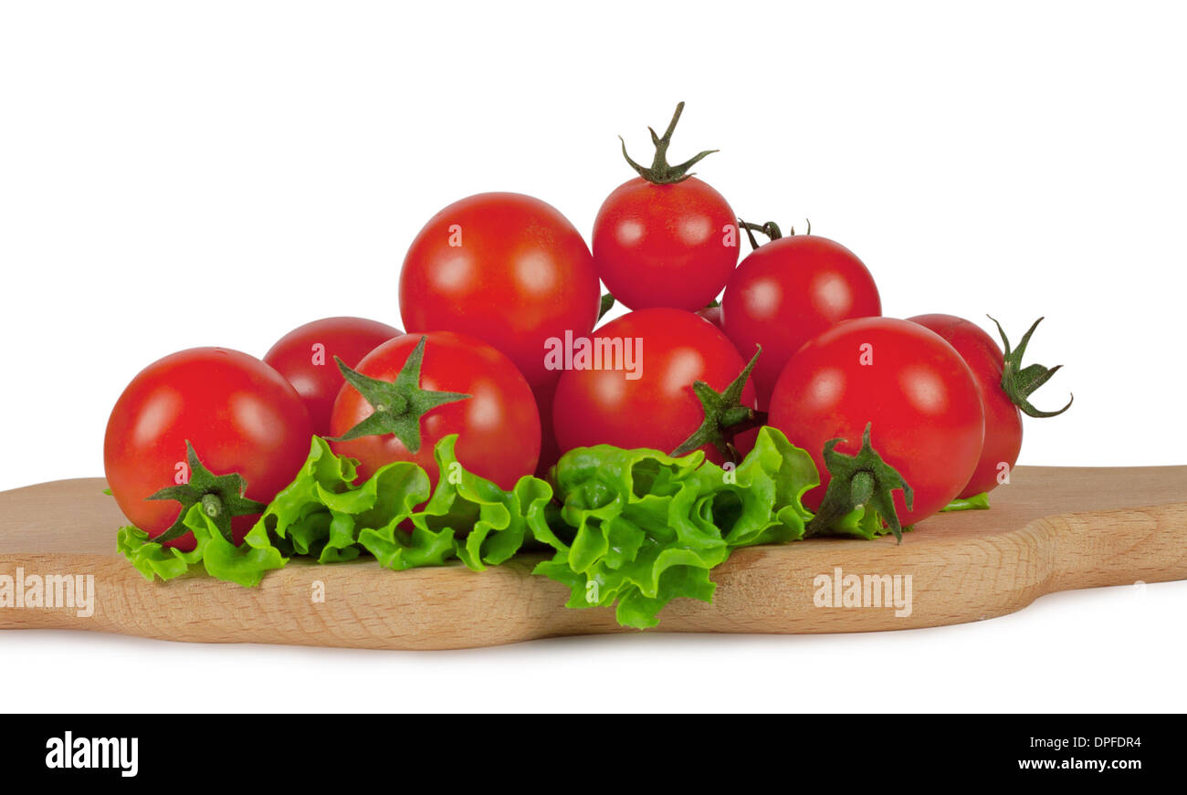 Cherry tomatoes on a cutting board isolated on white background Stock ...