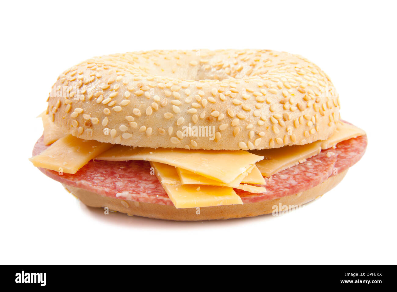 Fresh bagel filled with salami and cheese over white Stock Photo Alamy
