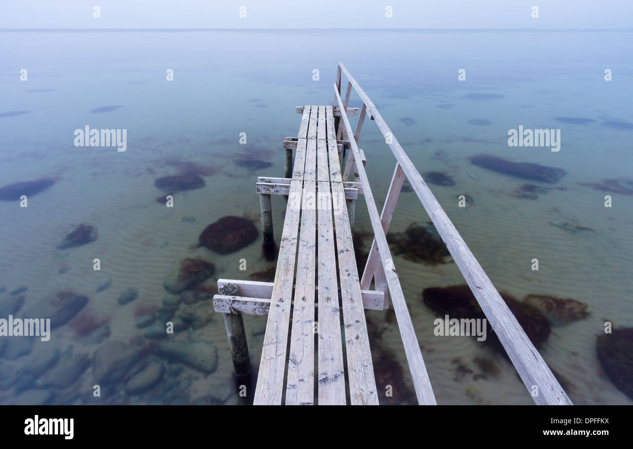 A bathing jetty (or "badebro") at dusk Smidstrup Strand, Denmark, August 2011 Stock Photo