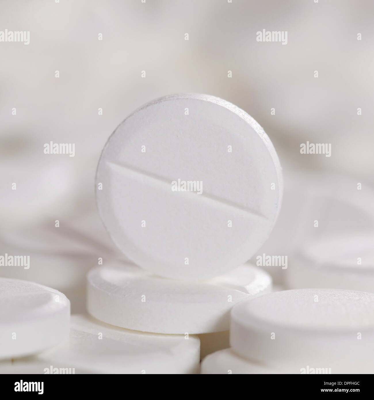 A white prescription pill on other pills, with copyspace for your own text Stock Photo