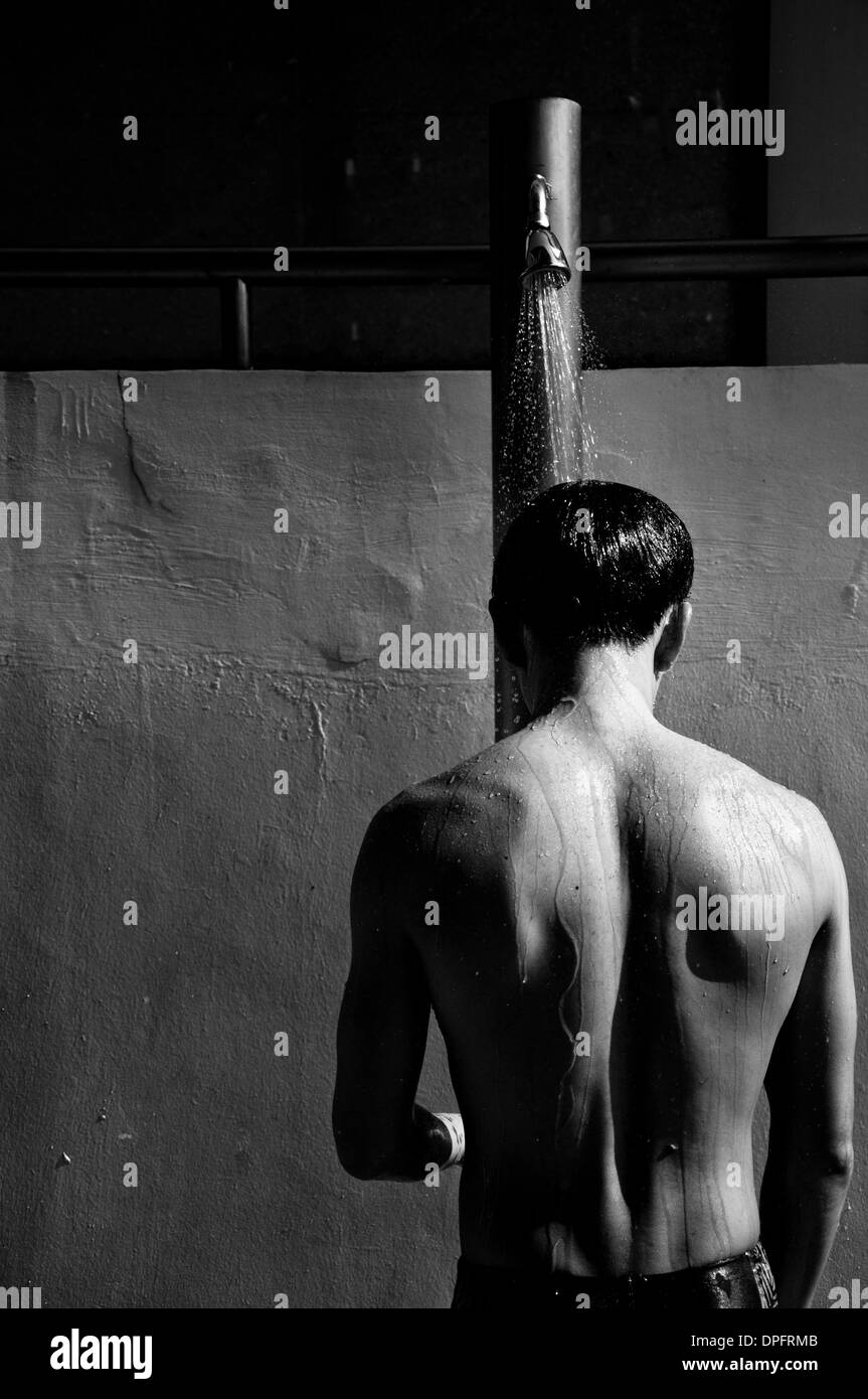 A person taking a shower before a swim Stock Photo Alamy