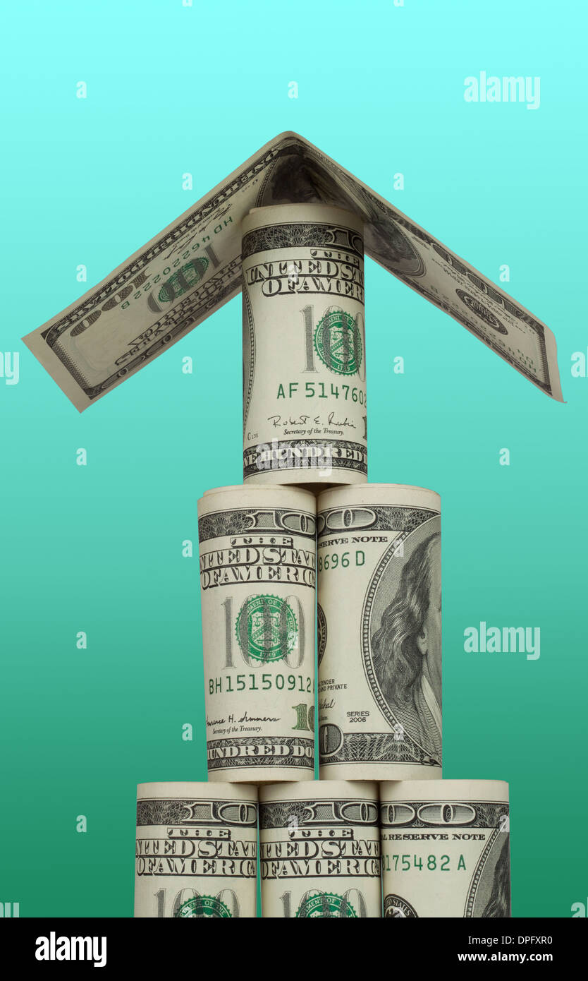 Pyramid of hundred dollar bills with a roof on a white background Stock Photo