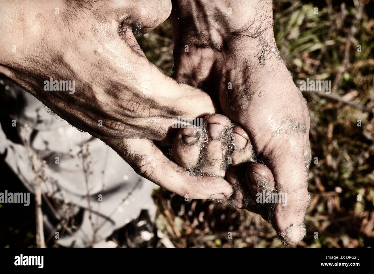 Washing hands after gardening Stock Photo Alamy