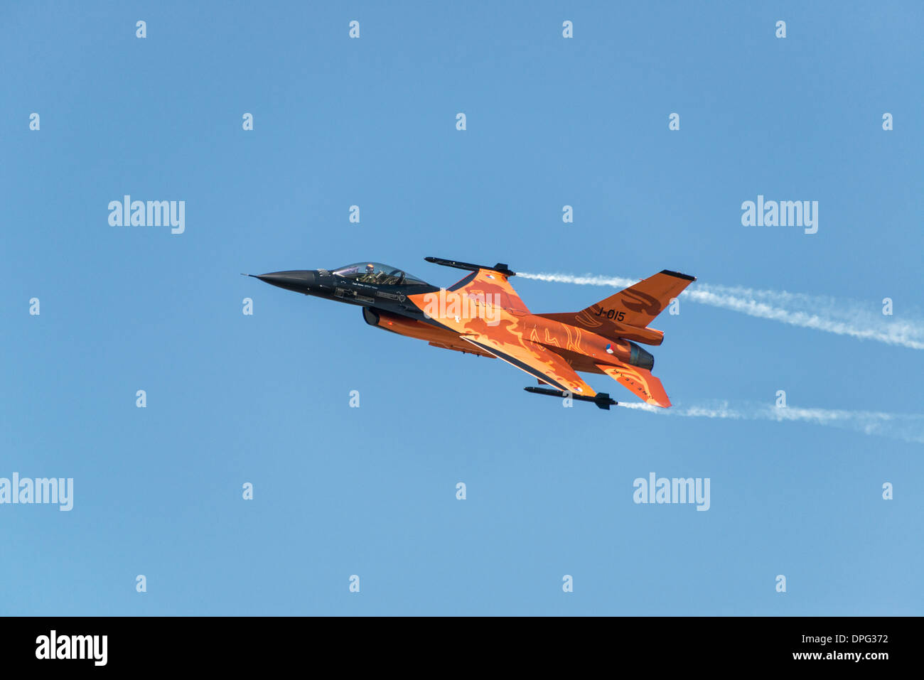 Captain Stefan 'Stitch' Hutten takes the orange Dutch F-16 through an impressive aerobatic display at the 2013 RIAT Stock Photo