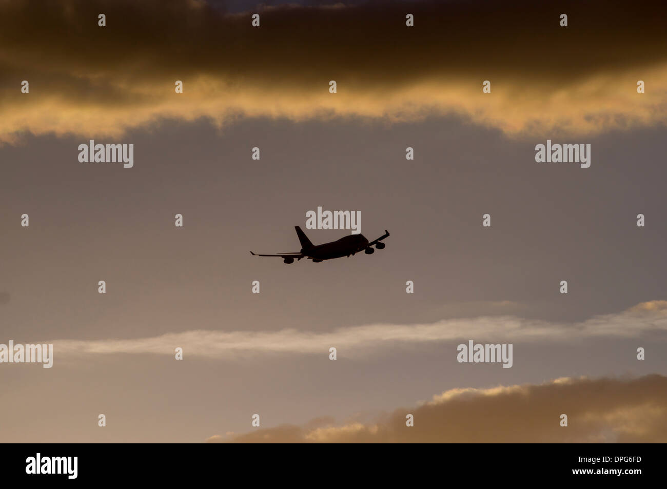 Airplane stormy sunset Stock Photo