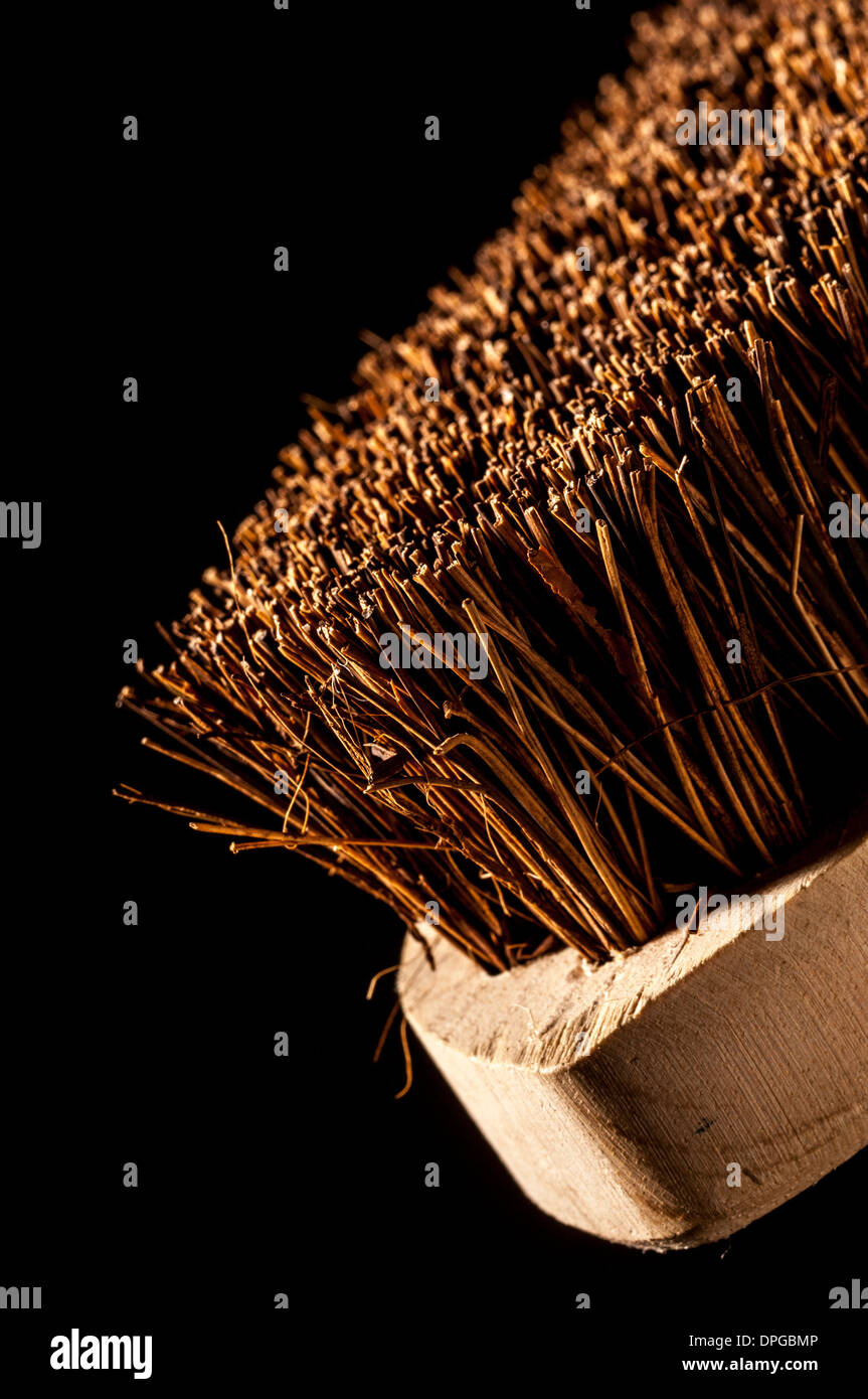 Scrubbing brush - closeup studio shot on a black background. Stock Photo