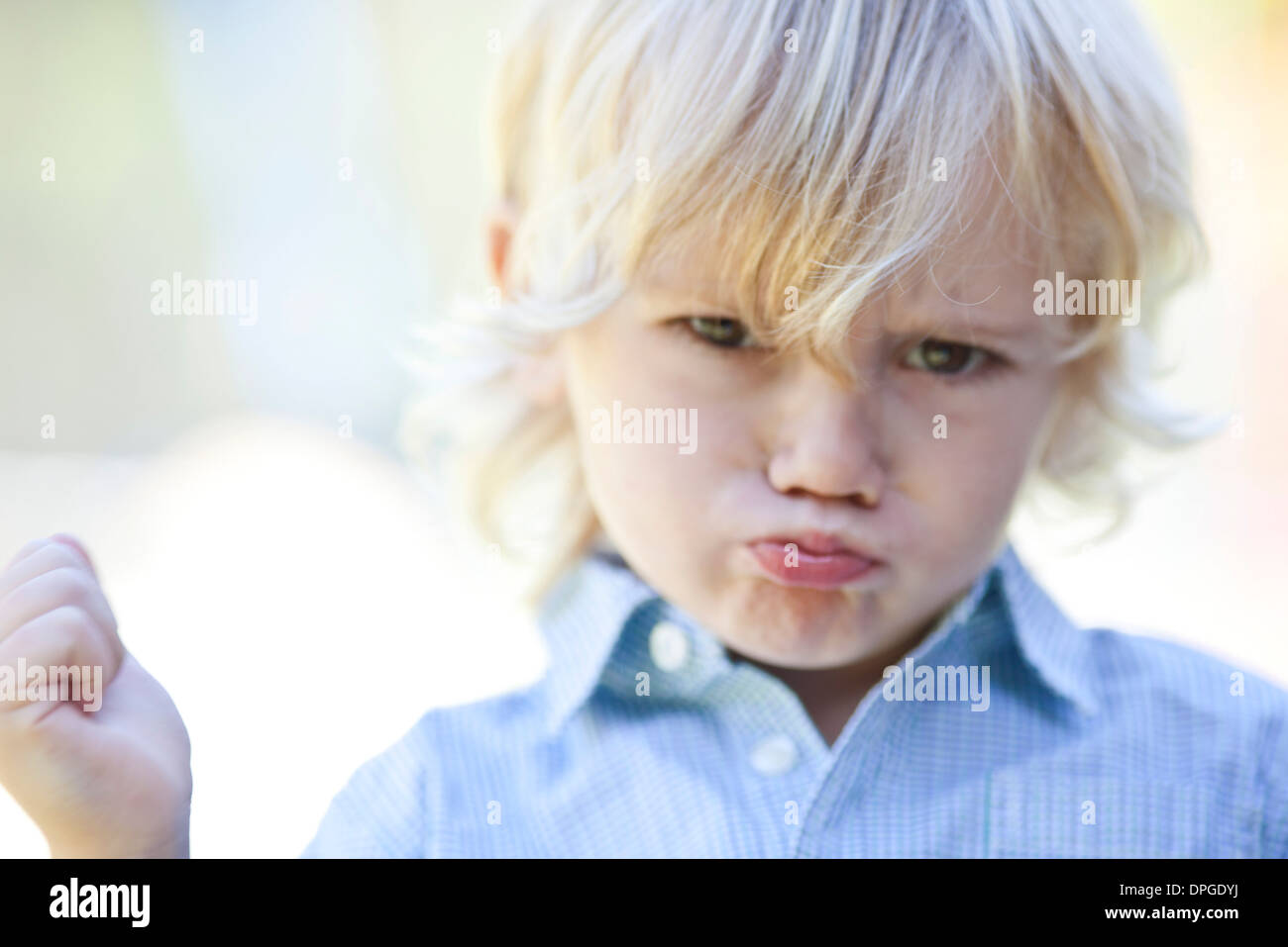 Little boy pouting Stock Photo - Alamy