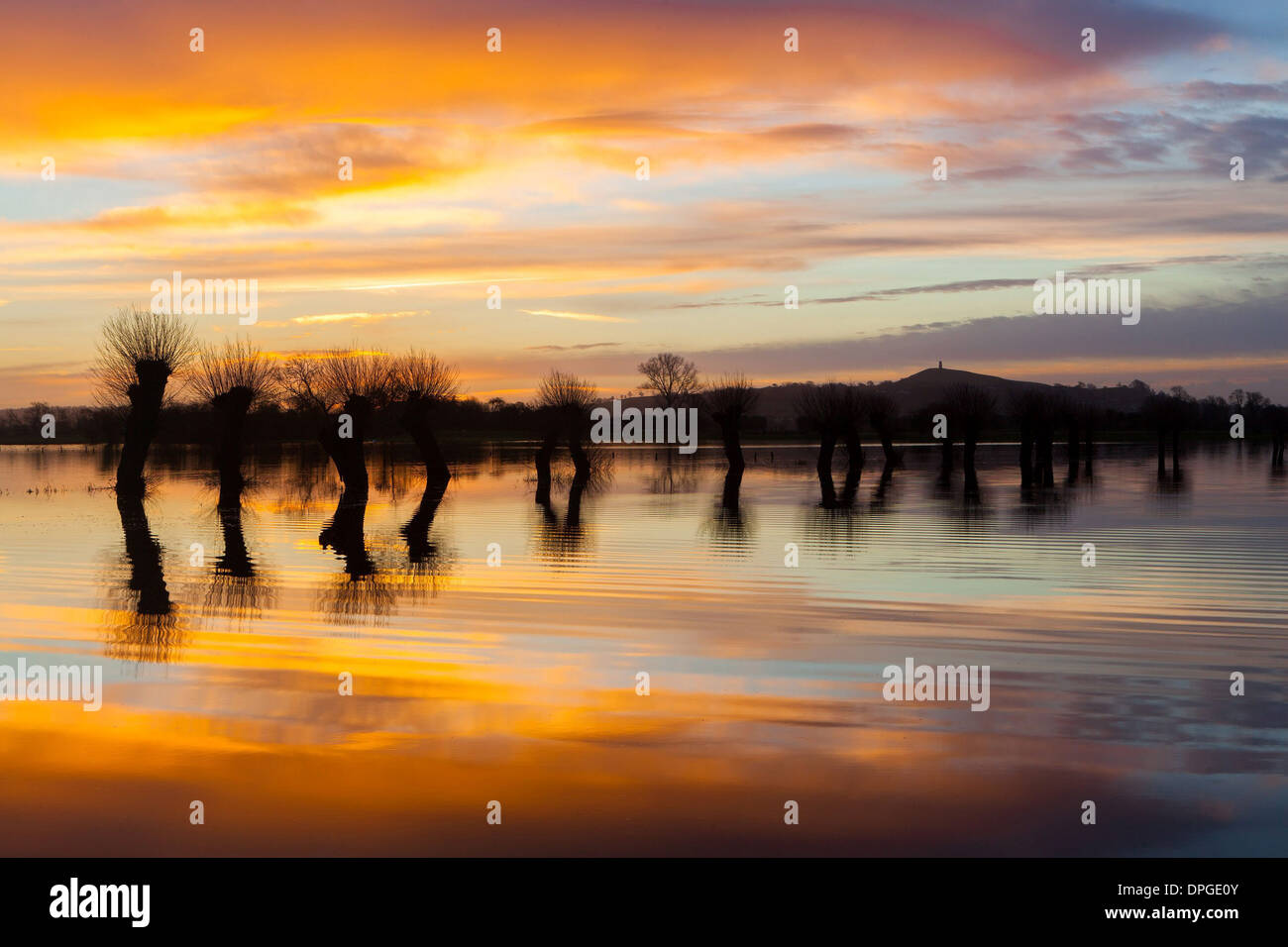 Glastonbury Tor is reflected in flooded fields Stock Photo